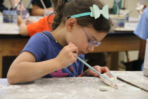 Camper doing Ceramics at Renbrook School Summer