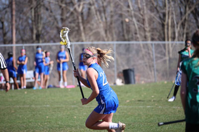 Girls' Lacrosse cradling the ball