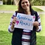 Kerry Doherty holding Renbrook Rocks sign