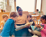 preschool teacher reading to students