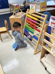 boy working with abacus