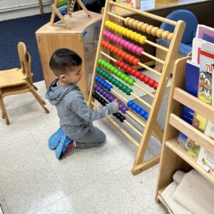 boy working with abacus