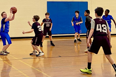 Basketball - Boys Junior Varsity player passing ball