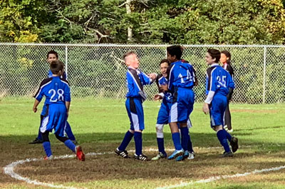 Soccer - Boys Junior Varsity players congratulating each other