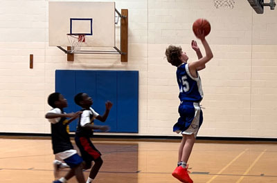 Basketball - Boys Varsity player shooting