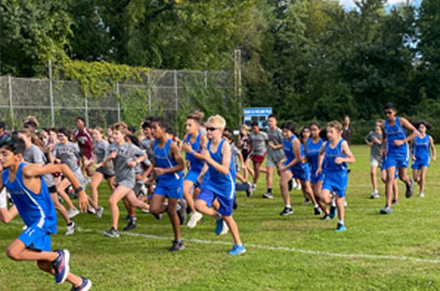 Cross Country runners running together in a pack