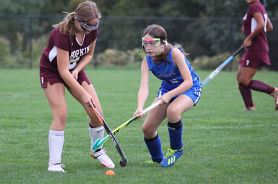 Field Hockey - Girls Varsity player trying to steal ball