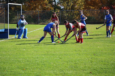 Field Hockey - Girls Varsity scrambling for ball