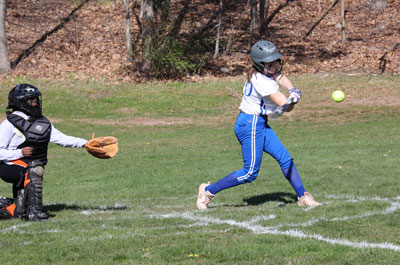 softball player batting