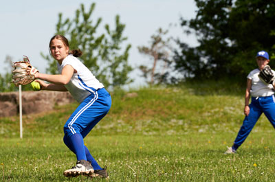 softball player pitching