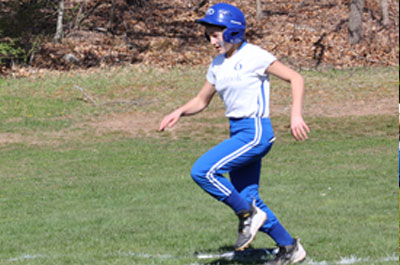 softball player running to home base