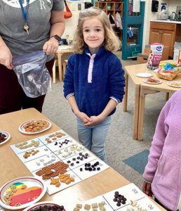 Kindergarten students learning to group numbers by 10