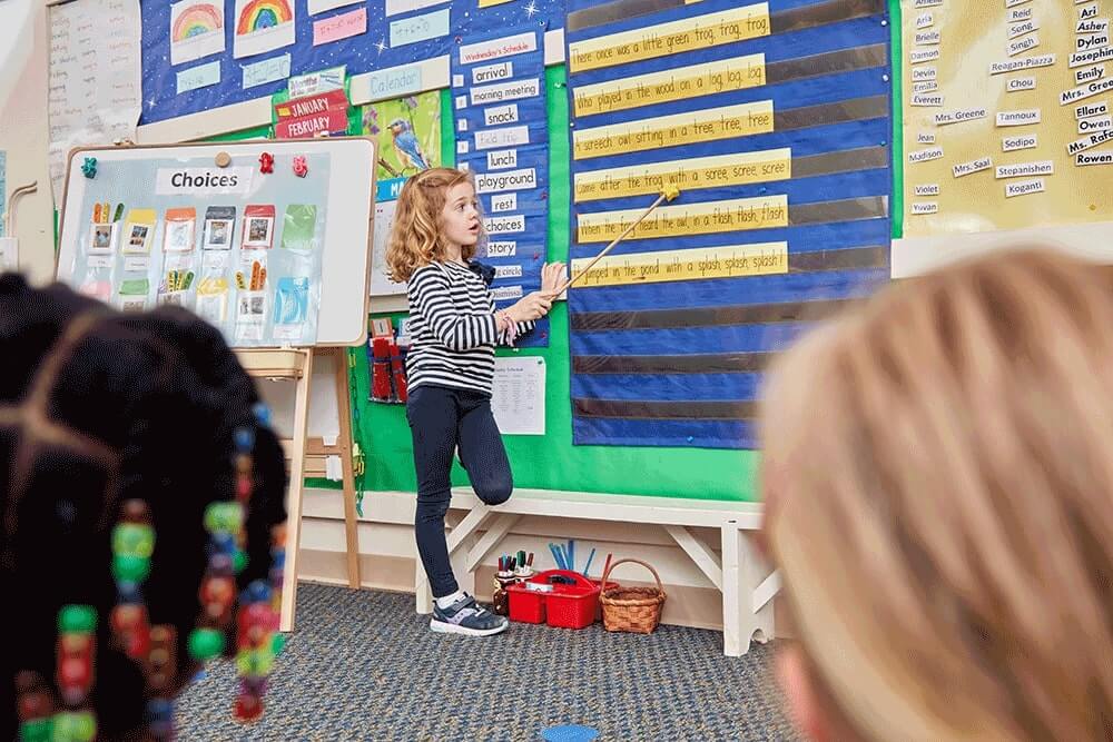 Kindergarten student at Renbrook reading a poem