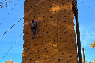 student climbing Renbrook climbing wall