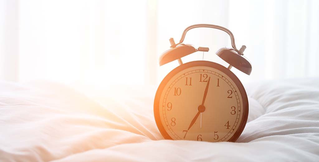 Alarm Clock on Bed