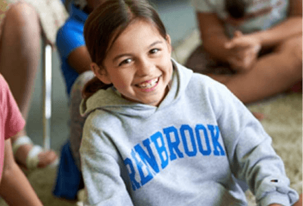 girl smiling in Renbrook sweatshirt