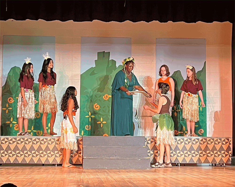 Students performing in Moana Jr.