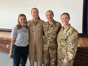 Group of three female pilots with STEM teacher