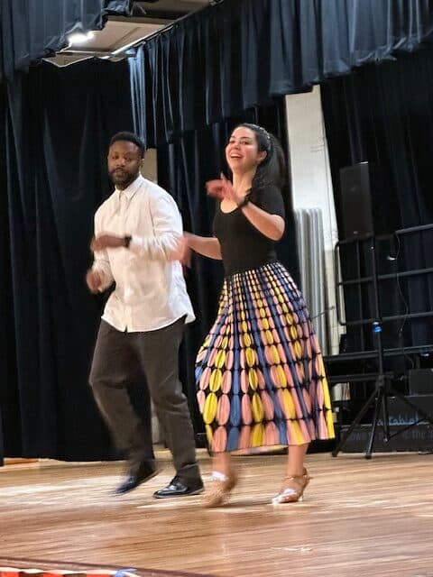 Male and female performing Latin dance