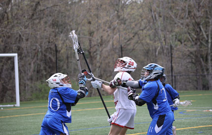 2 Renbrook School lacrosse players battling for ball