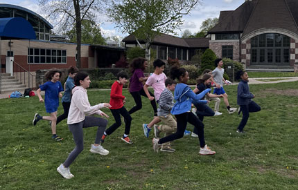 group of students warming up for road runners class