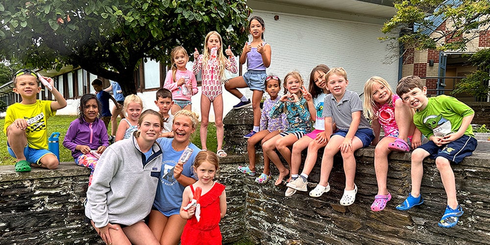 Owls group of third and fourth grade campers having popsicles