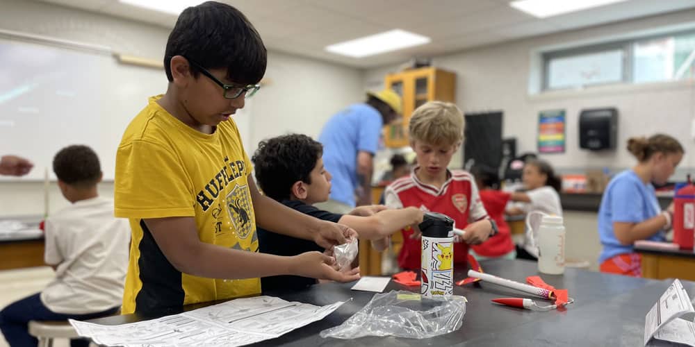 science-and-technology boys building rockets