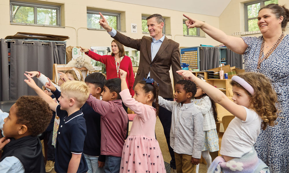 Head of School, Matt Sigirst, engaged with Kindergarten teachers and students learning their numbers
