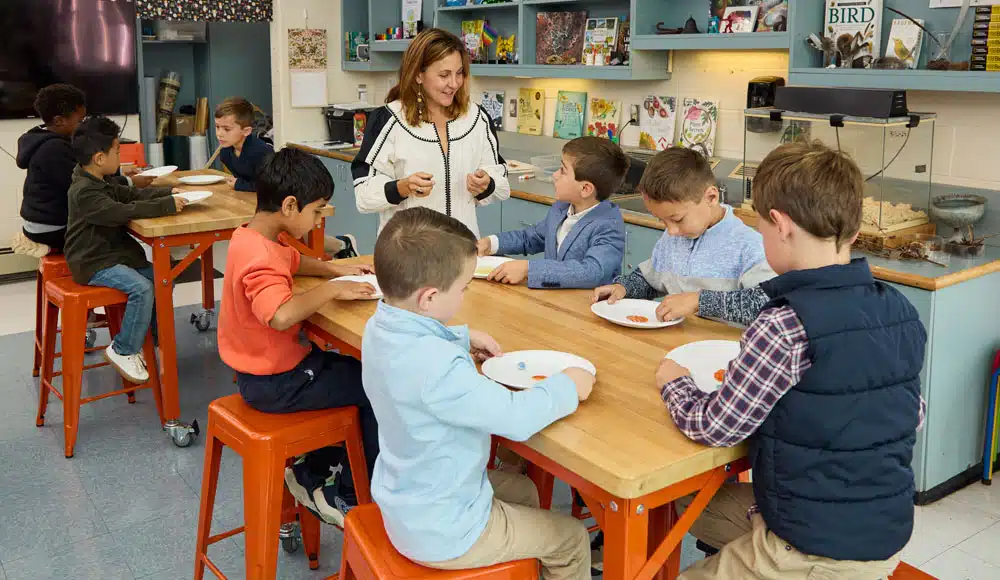 STEM classroom at Renbrook School with multiple first grade students engaged in learning about planets