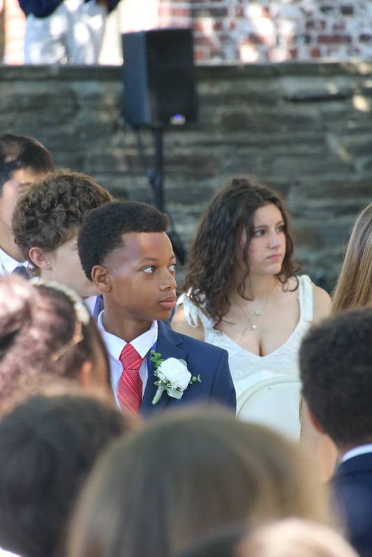 graduates listening to commencement address
