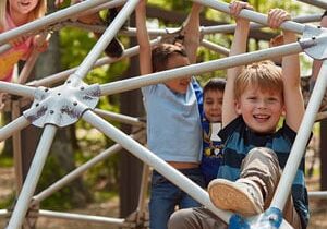 children playing on jungle gym