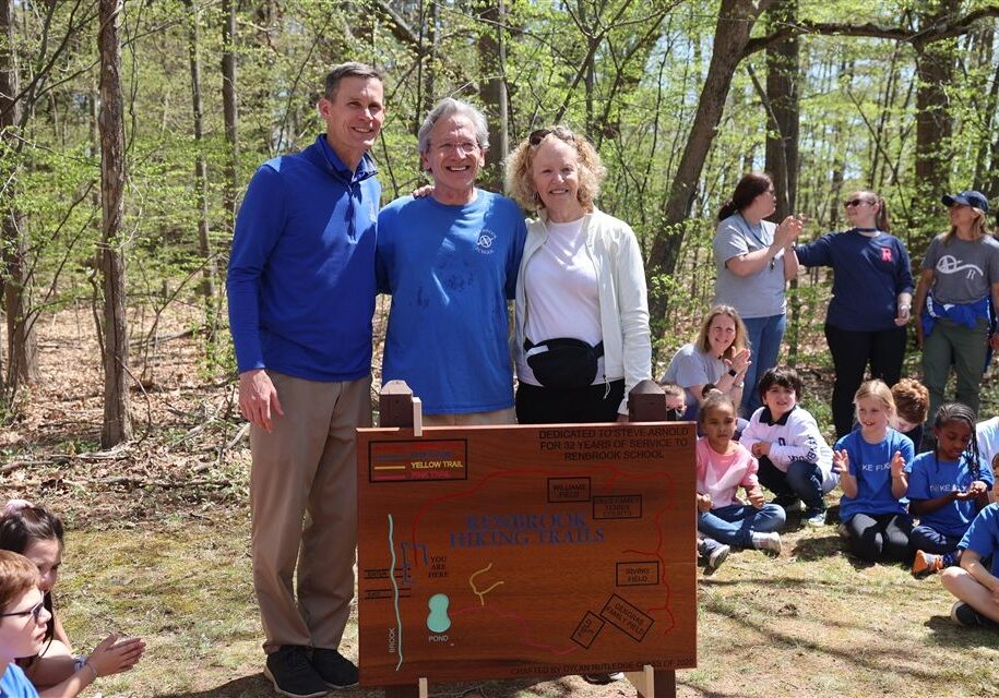 Head of School celebrating trail dedication with teacher and wife